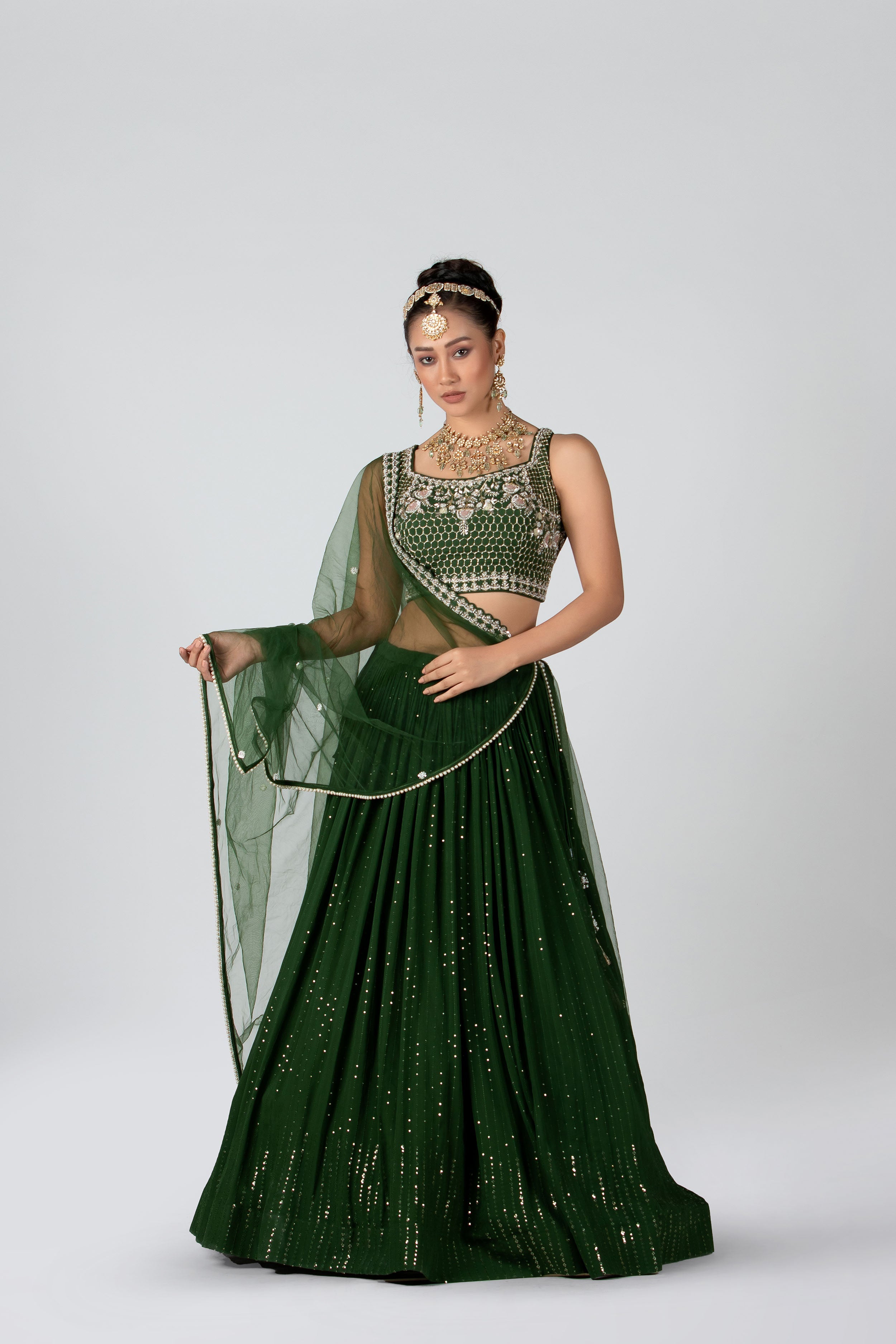 Dark green shop net lehenga