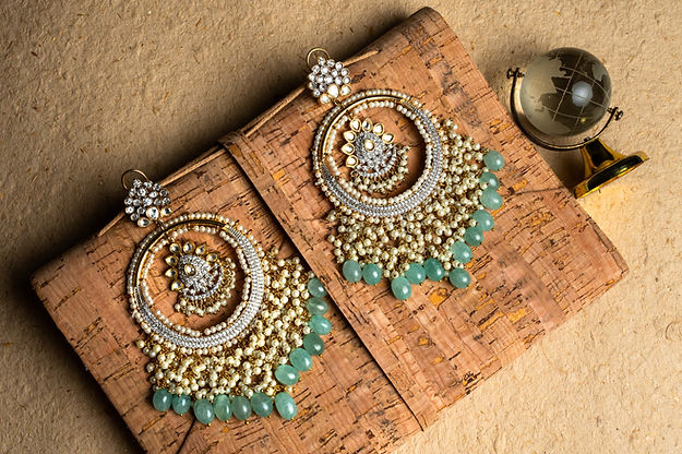 Jadau chaandbaalis With polkie And pearls And a finish With green beads