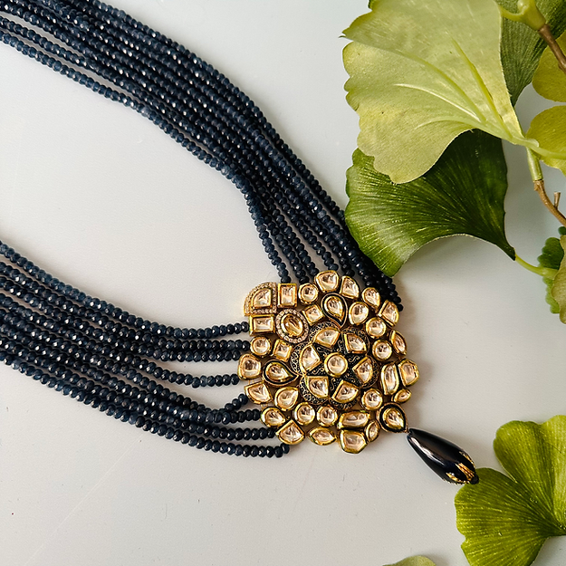 Nk piece With blue beads And a jadau pendant